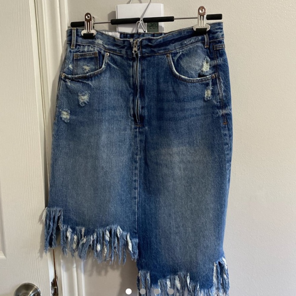Asymmetric denim fringe skirt